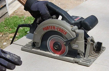 circular saw cutting a concrete driveway