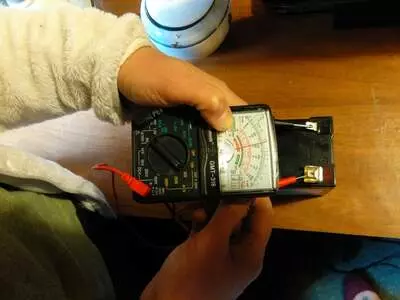 A multimeter measures electric current